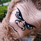 Sasquatch driver cover in a playful design, featuring a cartoon Bigfoot, placed on golf clubs.
