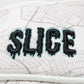 Shady Slice mallet cover featuring a vibrant design with tropical palm leaves and a secure elastic band for protection.