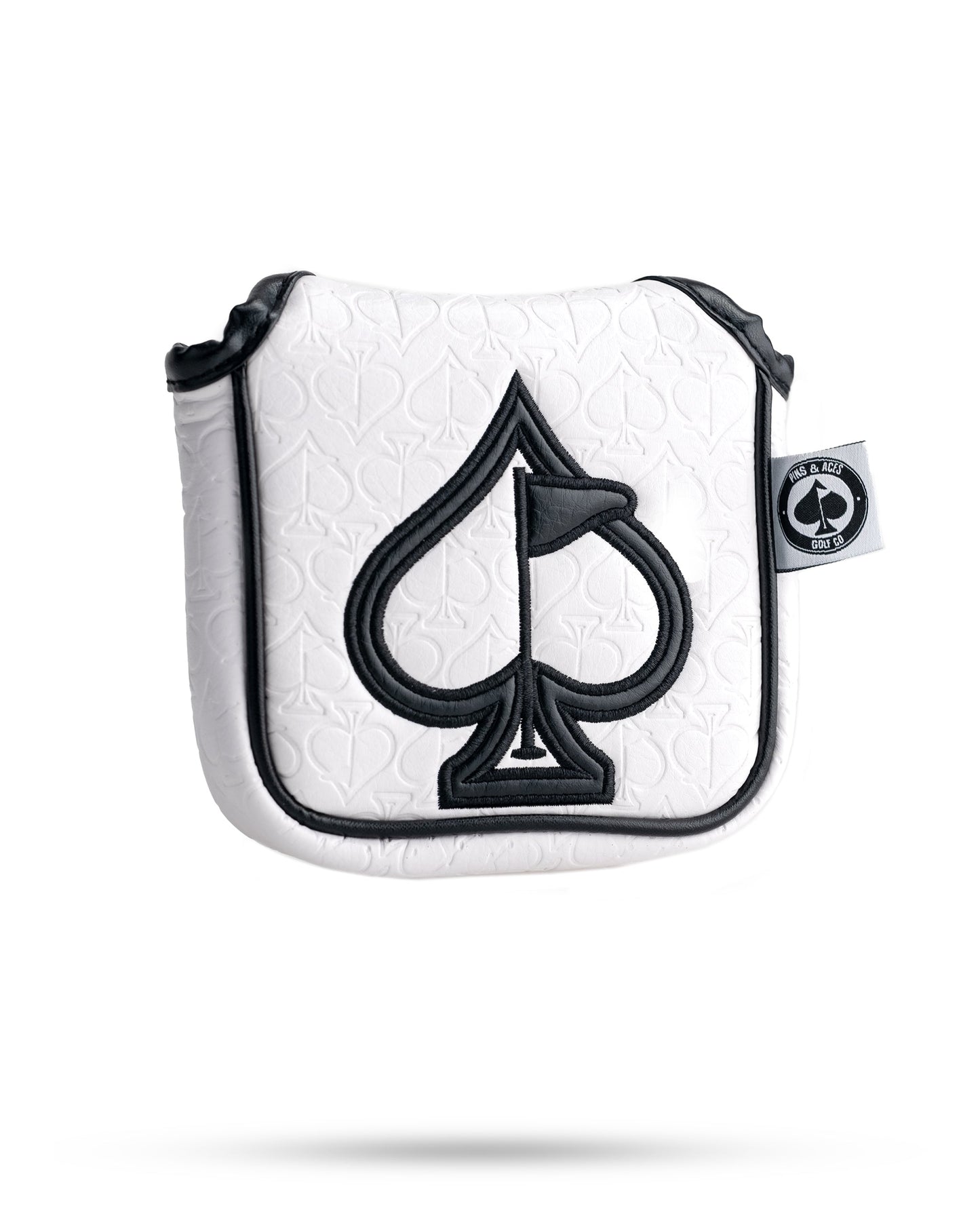 White golf headcover with black spade logo, embossed spade pattern, and bold black trim for standout style.
