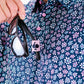 Daisy Daze floral print dress featuring a lightweight fabric, sleeveless design, and vibrant daisy patterns.