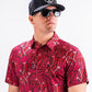 Men's garden party shirt featuring a vibrant crimson floral pattern against a dark background.