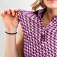 Women's houndstooth-patterned dress in raspberry color with short sleeves and a fitted silhouette.