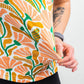 Women's Garden Party Spritz dress with floral design, short sleeves, and a flowing silhouette, set against a light background.
