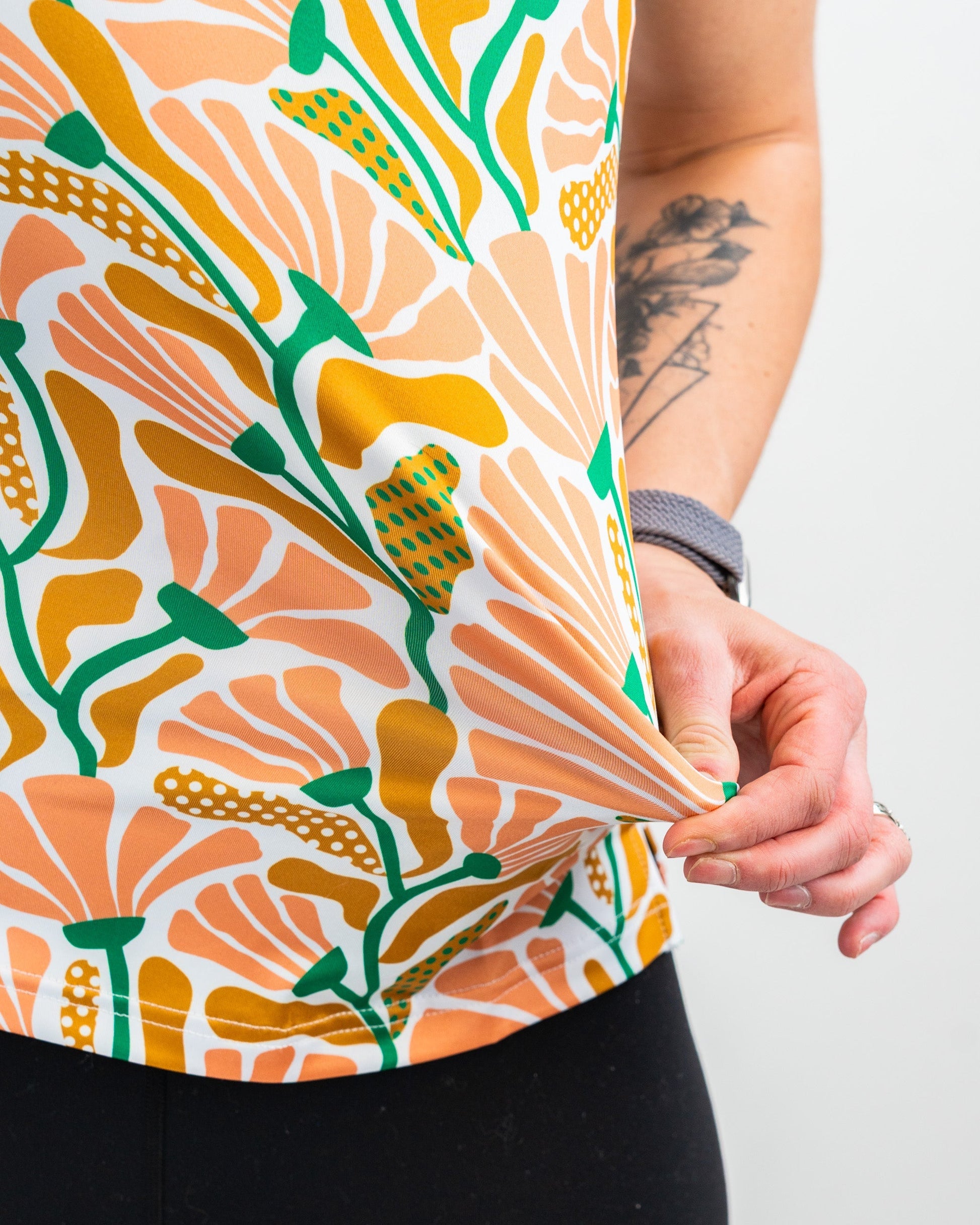 Women's Garden Party Spritz dress with floral design, short sleeves, and a flowing silhouette, set against a light background.