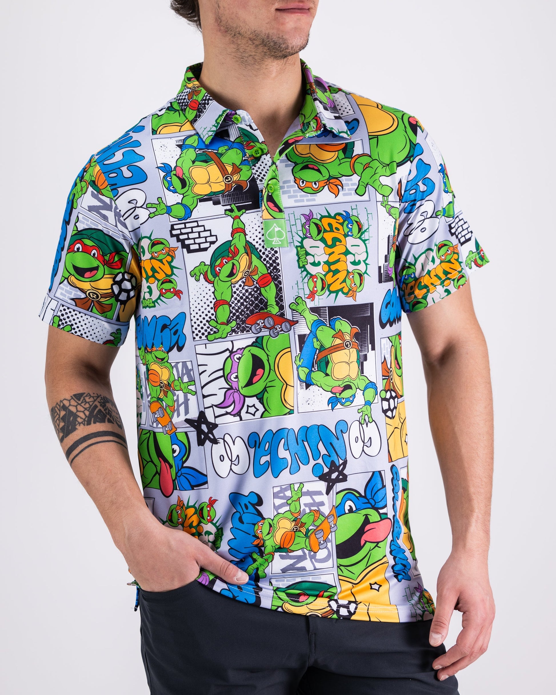 TMNT comic strip graphic featuring the Teenage Mutant Ninja Turtles on a colorful polo shirt.