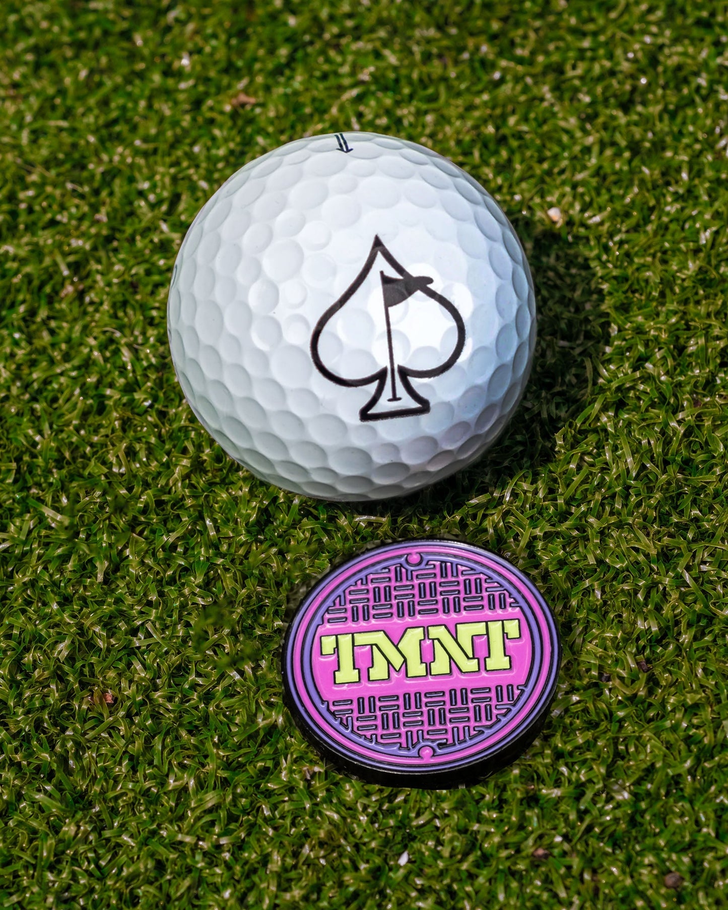 TMNT Sewer Cover Ball Marker featuring vibrant Teenage Mutant Ninja Turtles design with a circular shape and textured finish.