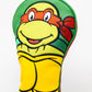 TMNT Raphael golf driver cover featuring a detailed design of the character's face, showcasing vibrant colors and an adjustable fitting.