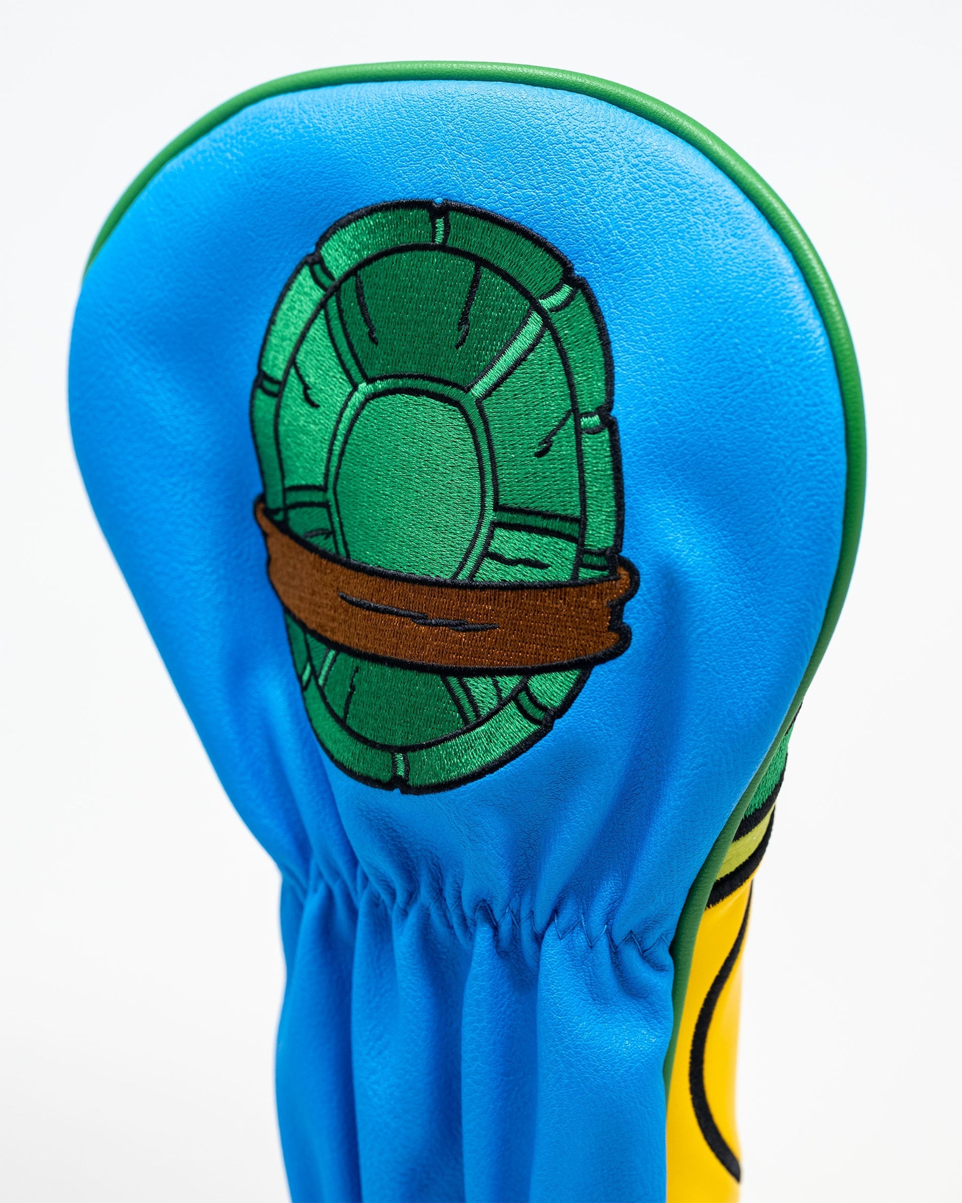 TMNT Leonardo driver cover featuring blue and green design with Leonardo's signature mask and sword graphics.
