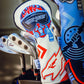 Top Gun Goose themed golf club headcover with embroidered logo and colorful design, placed among other golf club headcovers.