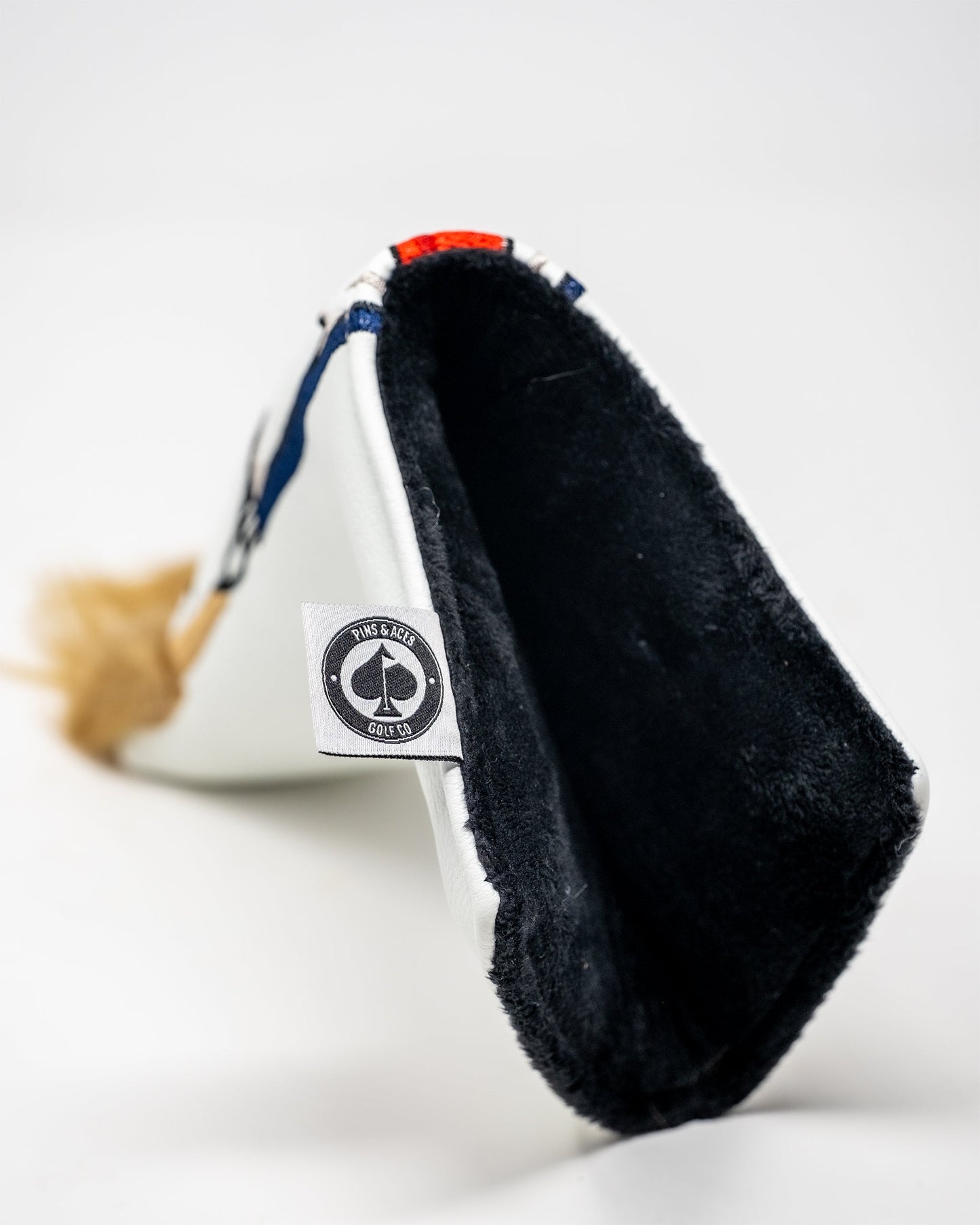 Trump Blade Putter Cover featuring a bold design with Trump’s likeness, ideal for golf enthusiasts.
