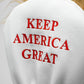 "Trump-themed driver golf club cover featuring a caricature of Donald Trump's head and signature hairstyle."