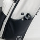 Player Preferred™ Golf Bag in Domino design featuring a sleek black and white pattern, with multiple pockets and a cup holder.