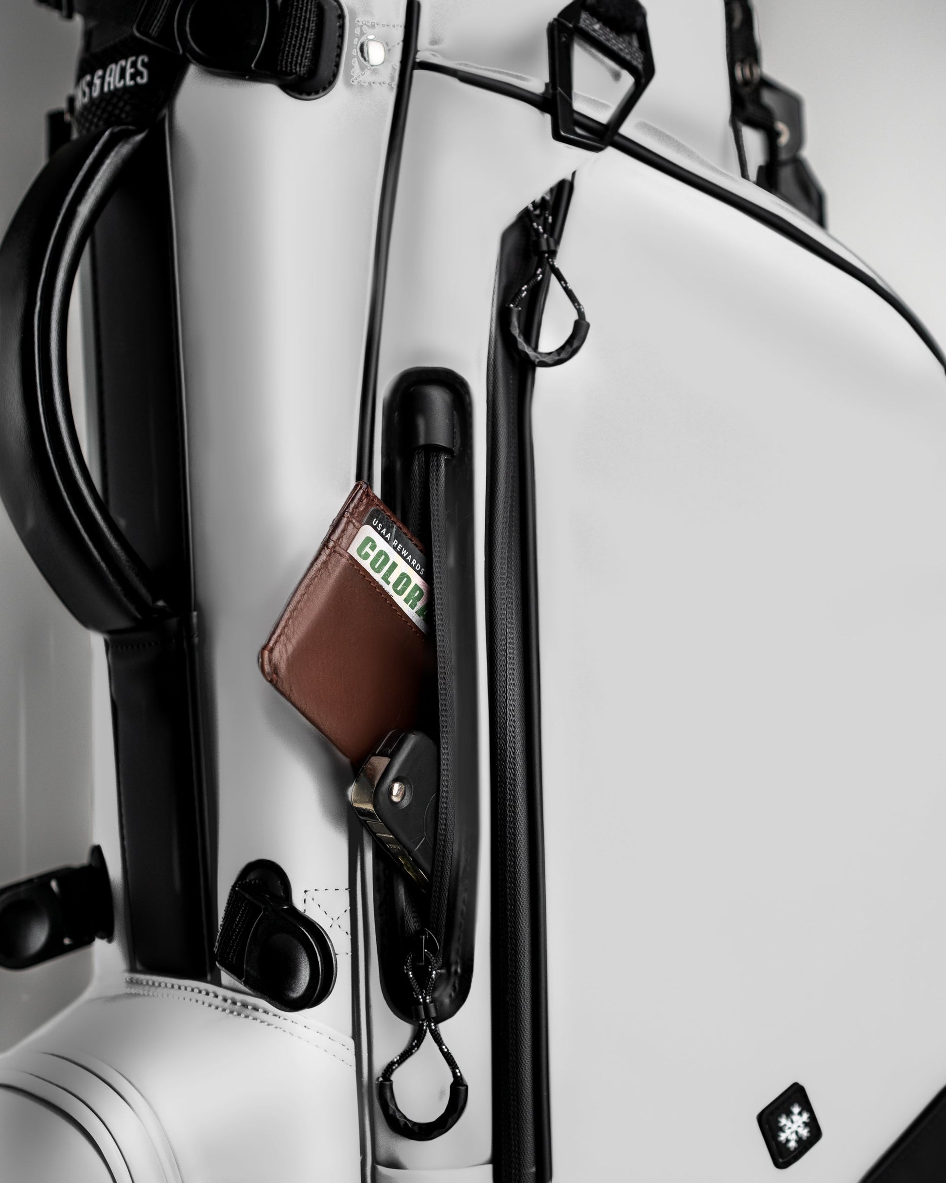 Player Preferred™ Golf Bag in Domino design, featuring a white exterior with ample storage pockets and a padded strap.