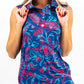 Women's Cabo Colada Sleeveless top in a vibrant tropical print, featuring a relaxed fit and round neckline, worn by a model against a bright background.