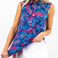 Women's Cabo Colada Sleeveless top featuring a relaxed fit and vibrant tropical print, modeled on a female figure against a neutral backdrop.
