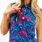 Alt text: Women's Cabo Colada sleeveless dress in a tropical print, featuring a relaxed fit and soft fabric, displayed on a model against a neutral background.