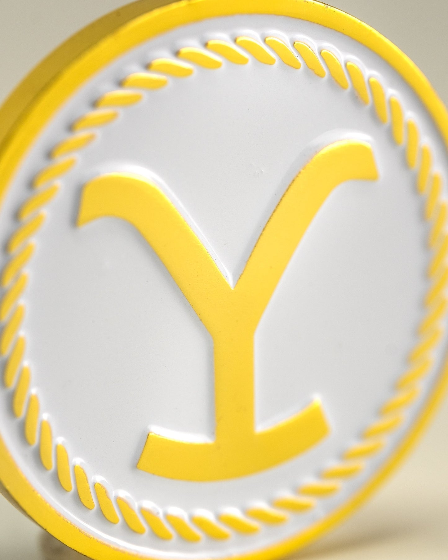 Yellowstone Ball Marker featuring a detailed design with the iconic Yellowstone National Park logo in vibrant colors.