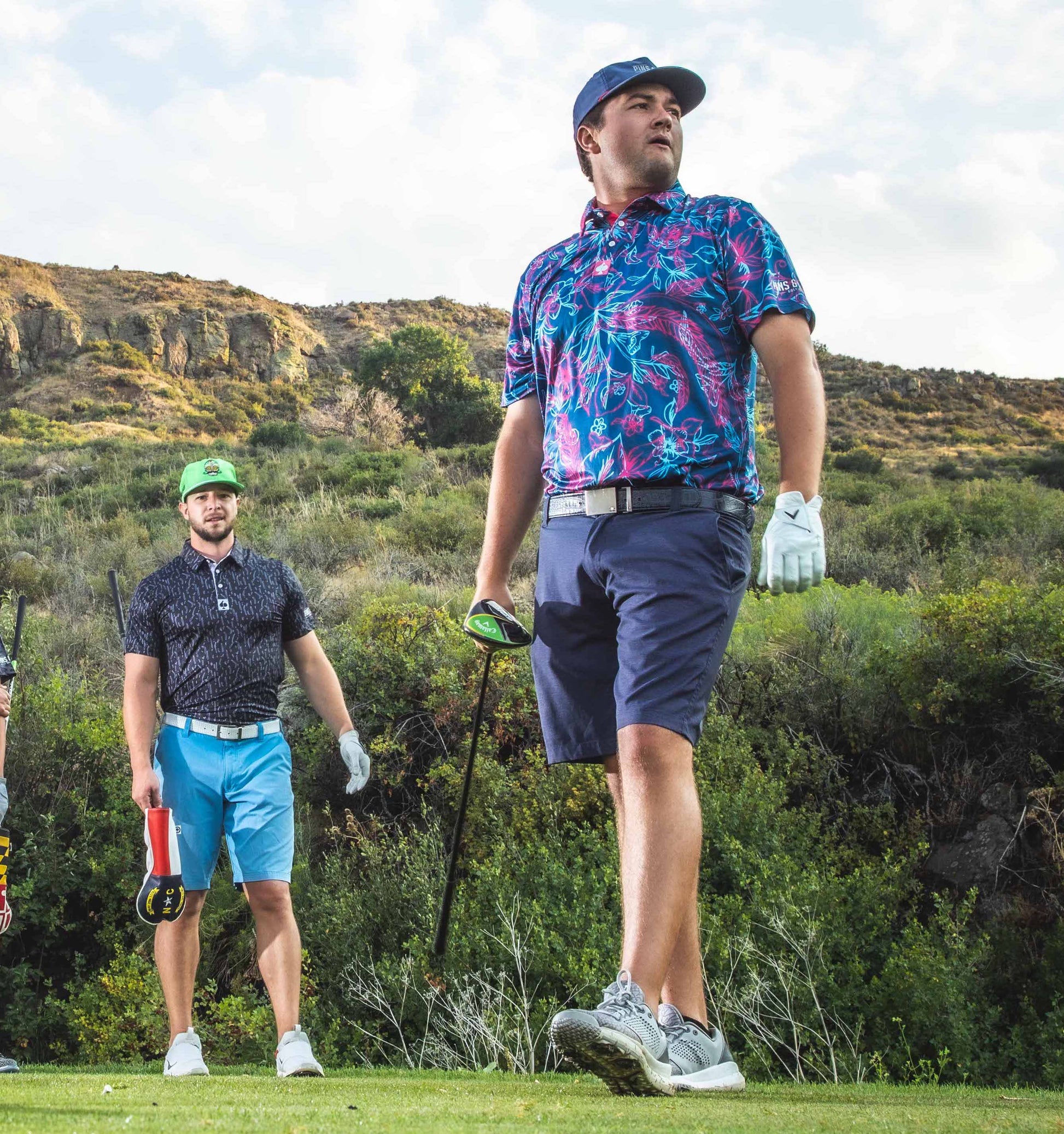 Cabo Colada polo shirt featuring a colorful tropical print on a light background.